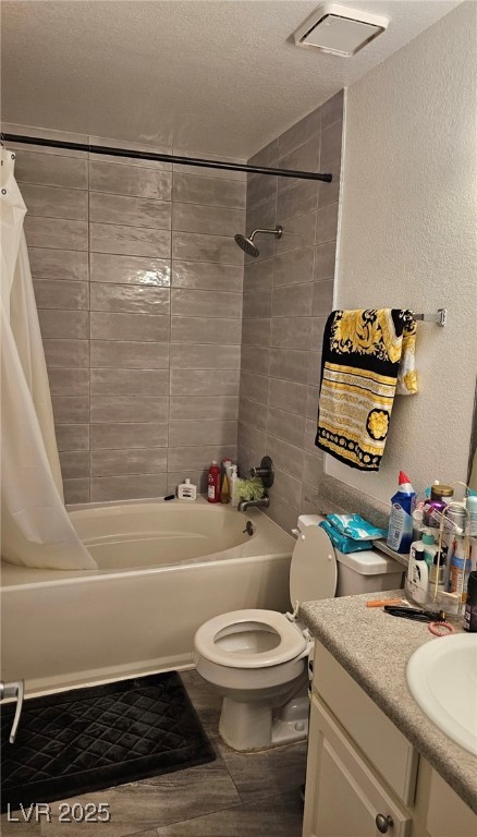 3151 North Soaring Gulls Drive, Unit 2211 Las Vegas, NV 89128 - Photo 10 of 20 Full bath with a textured wall, shower / tub combo with curtain, vanity, and a textured ceiling