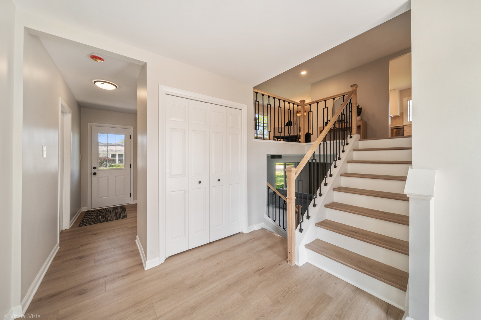 21-w040 Monticello Road Lombard, IL 60148 - Photo 12 of 33 a view of entryway with wooden floor and stairs