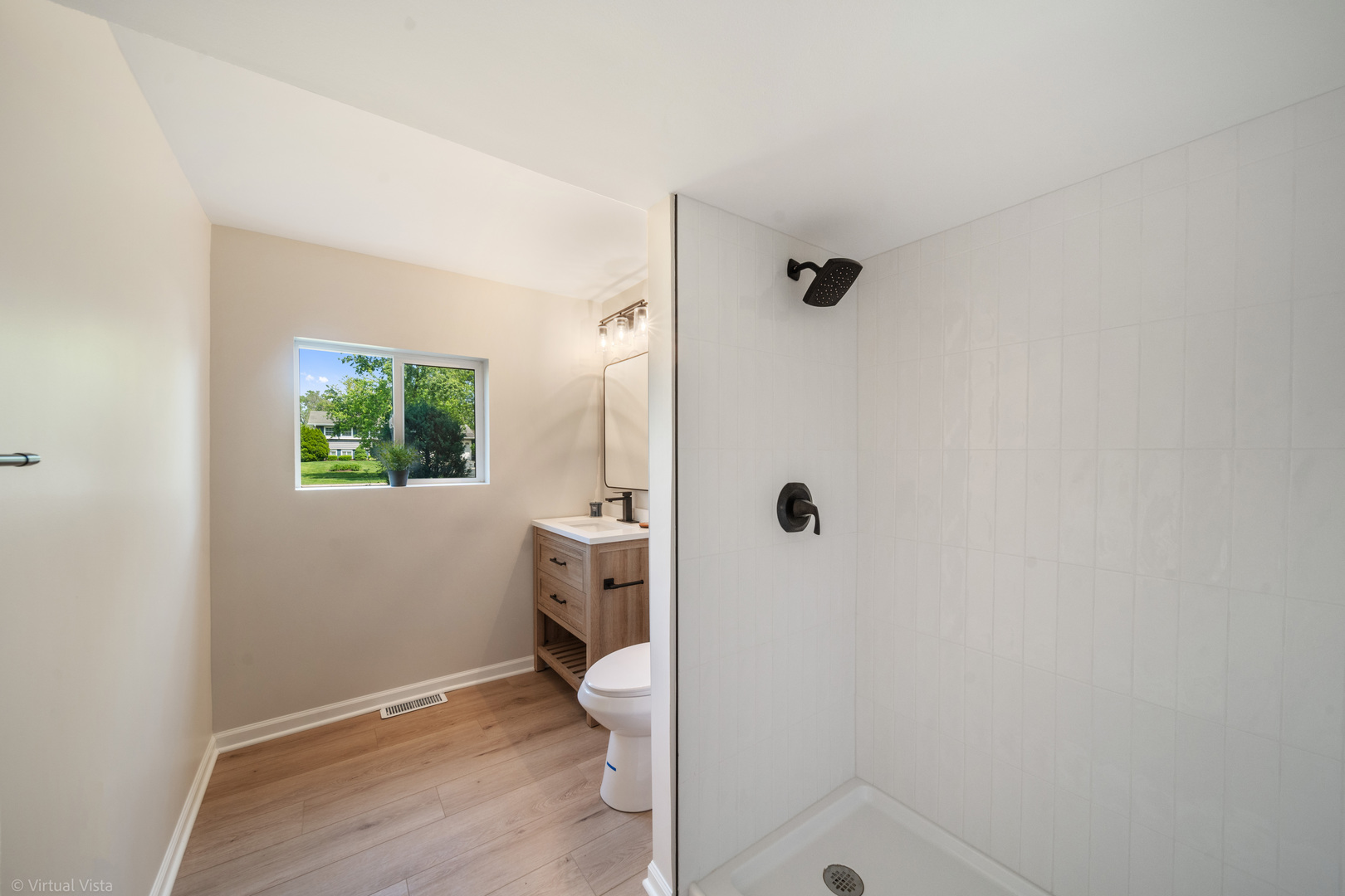 21-w040 Monticello Road Lombard, IL 60148 - Photo 23 of 33 a bathroom with a toilet and a shower