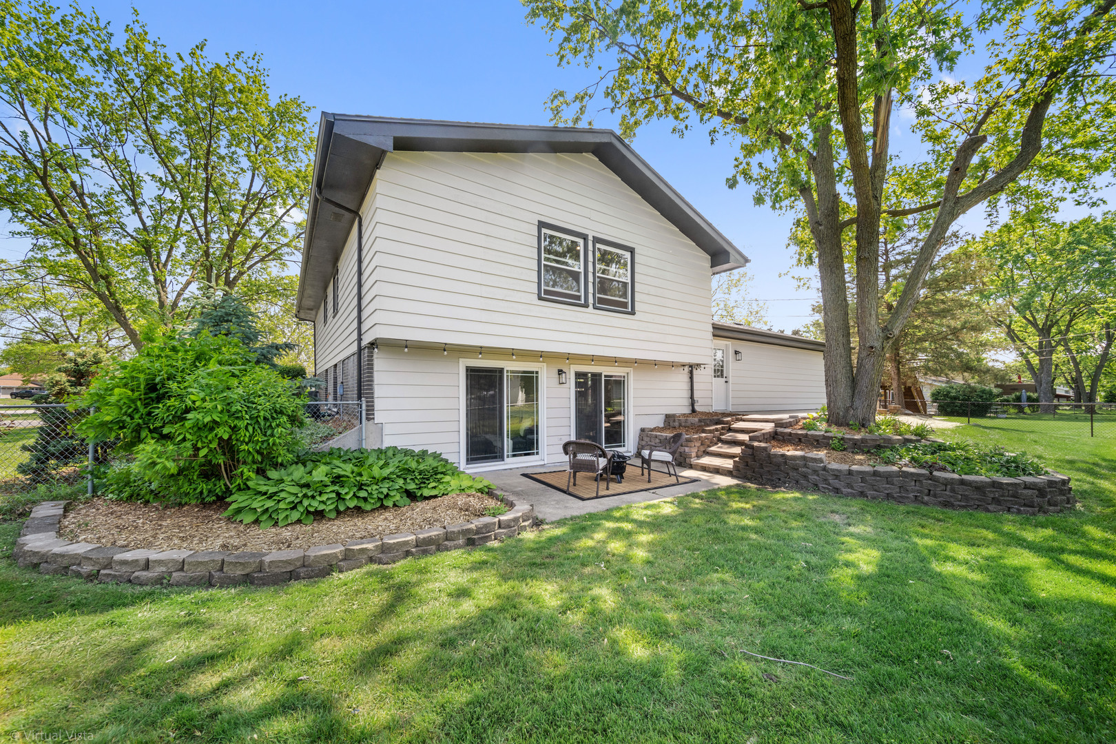 21-w040 Monticello Road Lombard, IL 60148 - Photo 28 of 33 a view of a house with backyard and sitting area