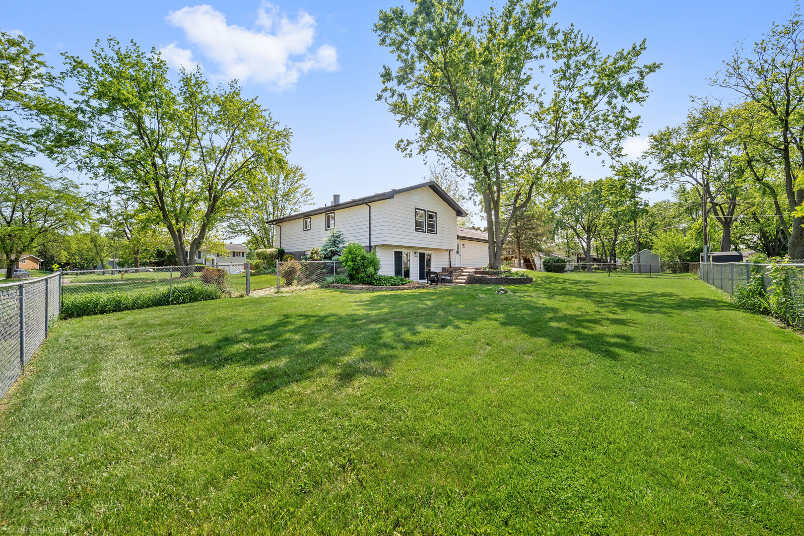 21-w040 Monticello Road Lombard, IL 60148 - Photo 29 of 33 a front view of house with a garden