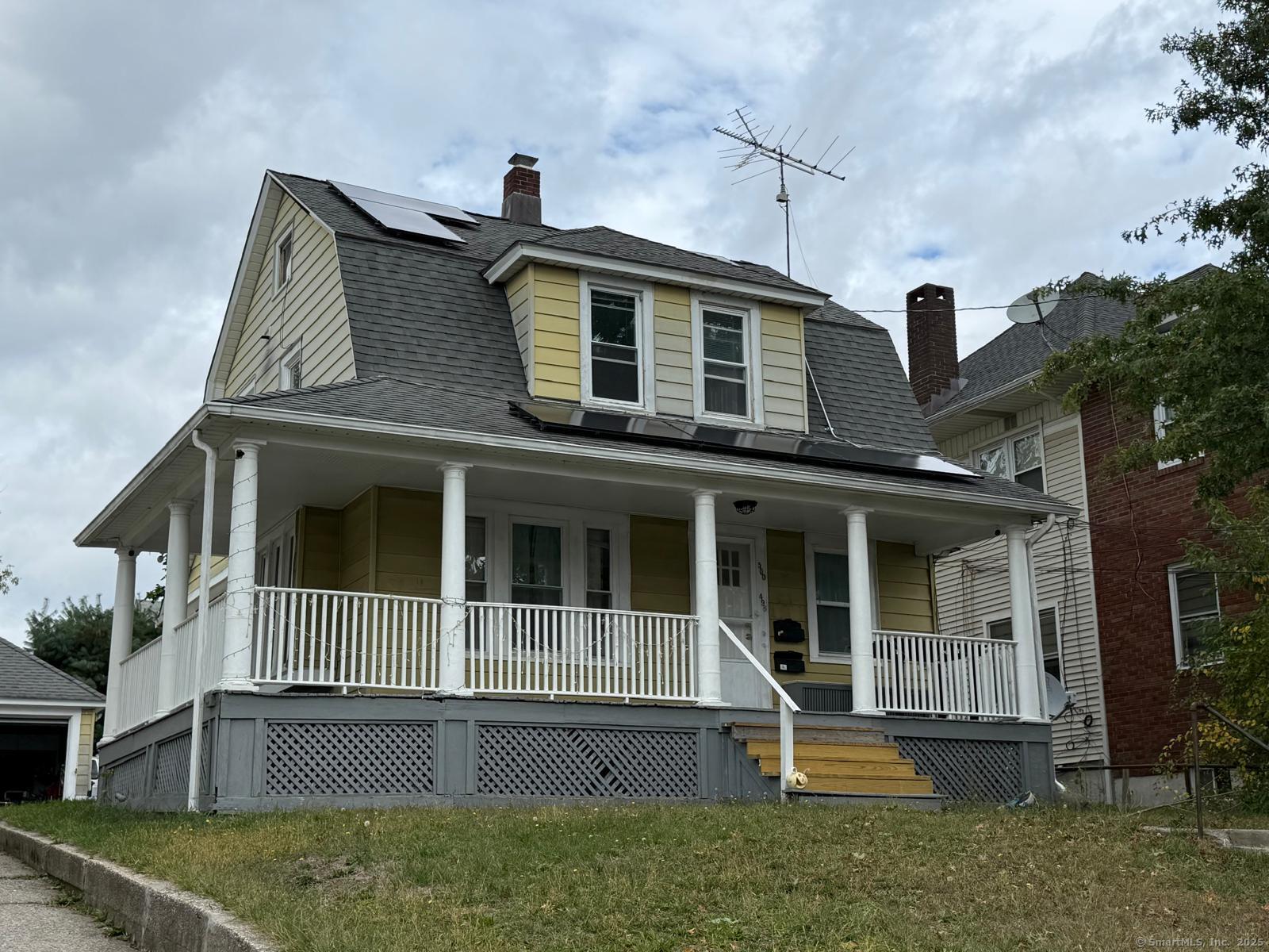 front view of a house with a yard