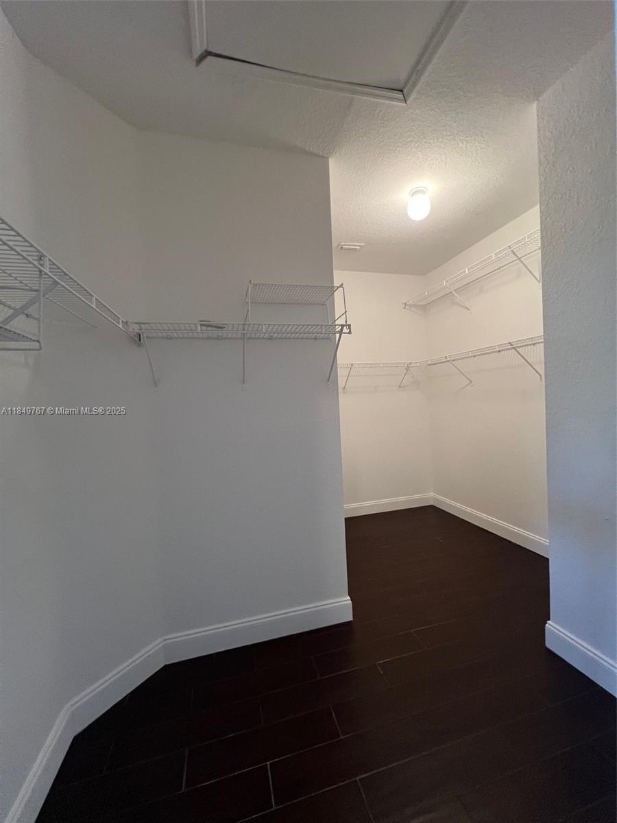 12724 Southwest 133rd Street Miami, FL 33186 - Photo 17 of 33 an empty room with wooden floor and windows