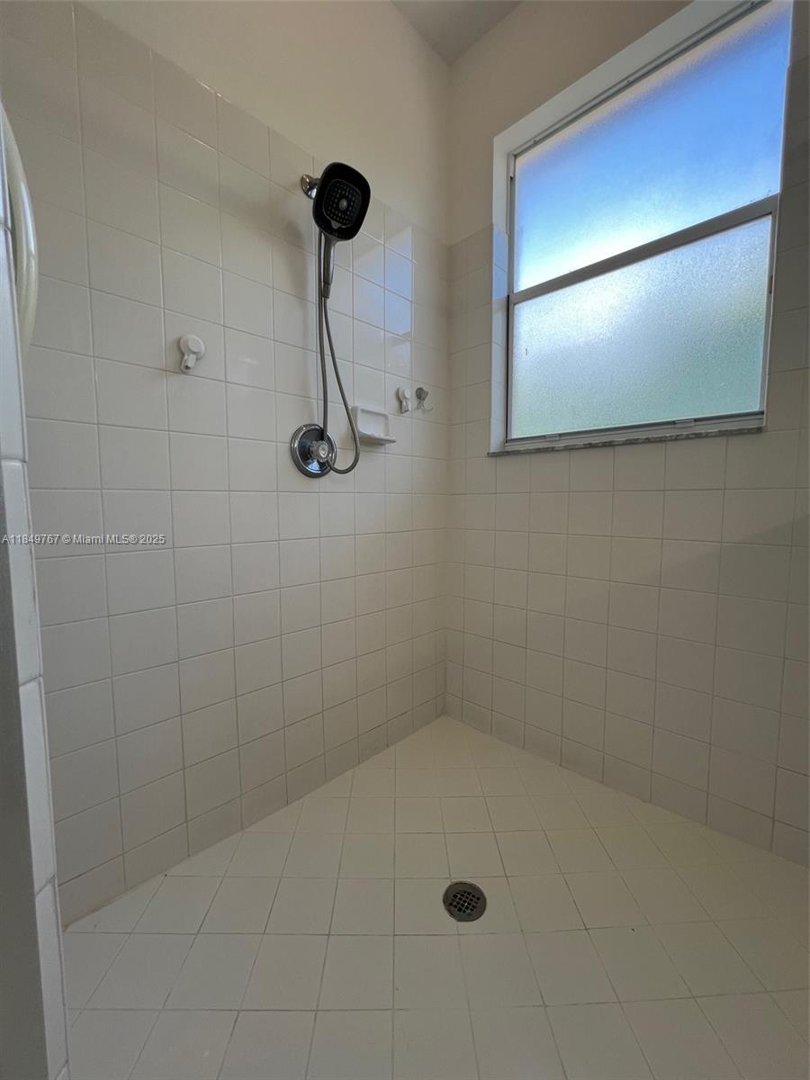12724 Southwest 133rd Street Miami, FL 33186 - Photo 19 of 33 a bathroom with a shower