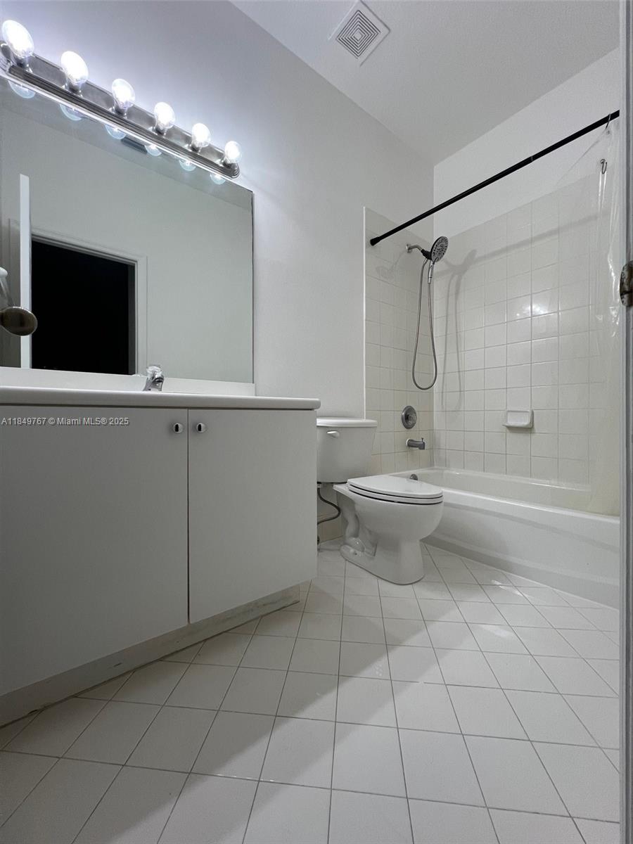 12724 Southwest 133rd Street Miami, FL 33186 - Photo 22 of 33 a view of a bathroom with a shower and a toilet