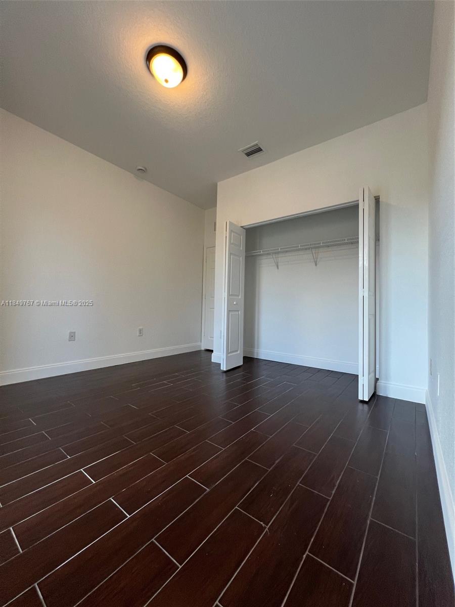 12724 Southwest 133rd Street Miami, FL 33186 - Photo 24 of 33 a view of room with gym equipment