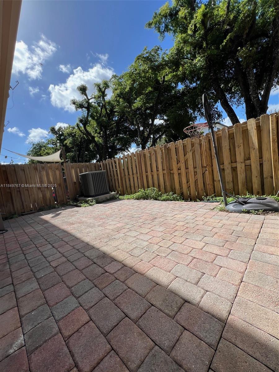 12724 Southwest 133rd Street Miami, FL 33186 - Photo 26 of 33 a view of backyard with wooden fence
