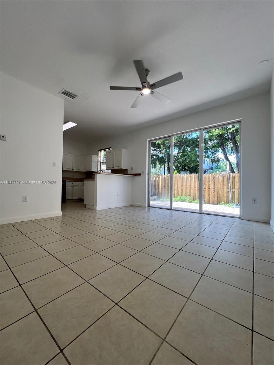12724 Southwest 133rd Street Miami, FL 33186 - Photo 10 of 33 a view of kitchen with furniture and refrigerator