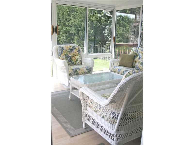 224 Monks Road Valencia, PA 16059 - Photo 11 of 25 Sunroom. The welcoming sunporch affords privacy and the perfect relaxation retreat.