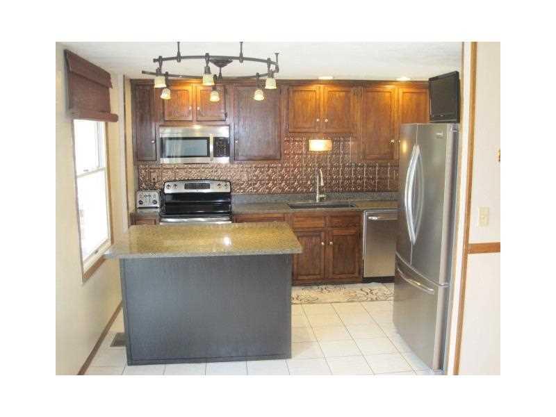 224 Monks Road Valencia, PA 16059 - Photo 6 of 25 Kitchen. Spacious kitchen with stainless steel appliances, island with additional seating area, patio doors leading to sunroom.