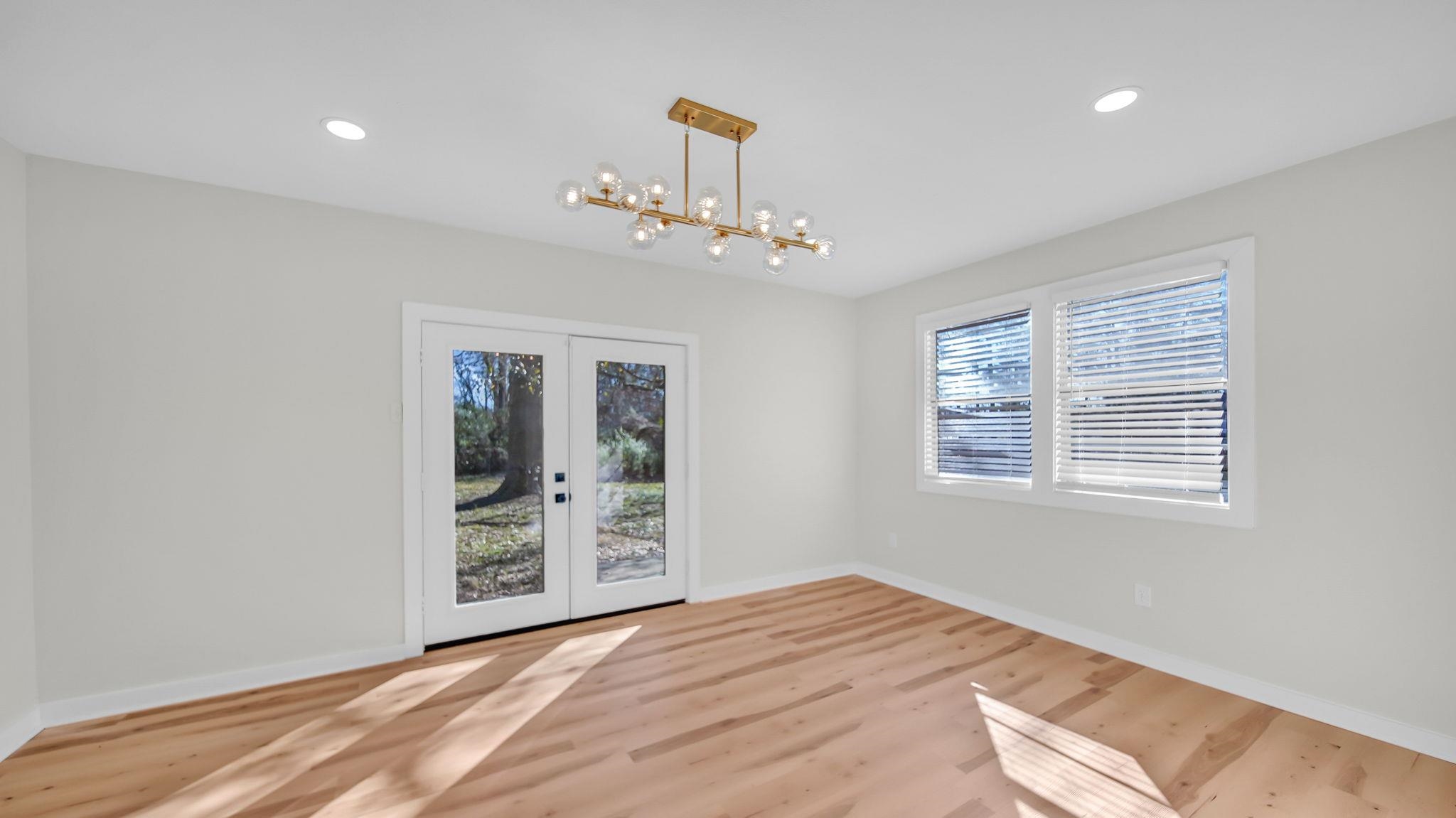 2800 Spring Hill Drive Memphis, TN 38127 - Photo 19 of 31 Unfurnished dining area featuring french doors, light wood-style floors, and recessed lighting