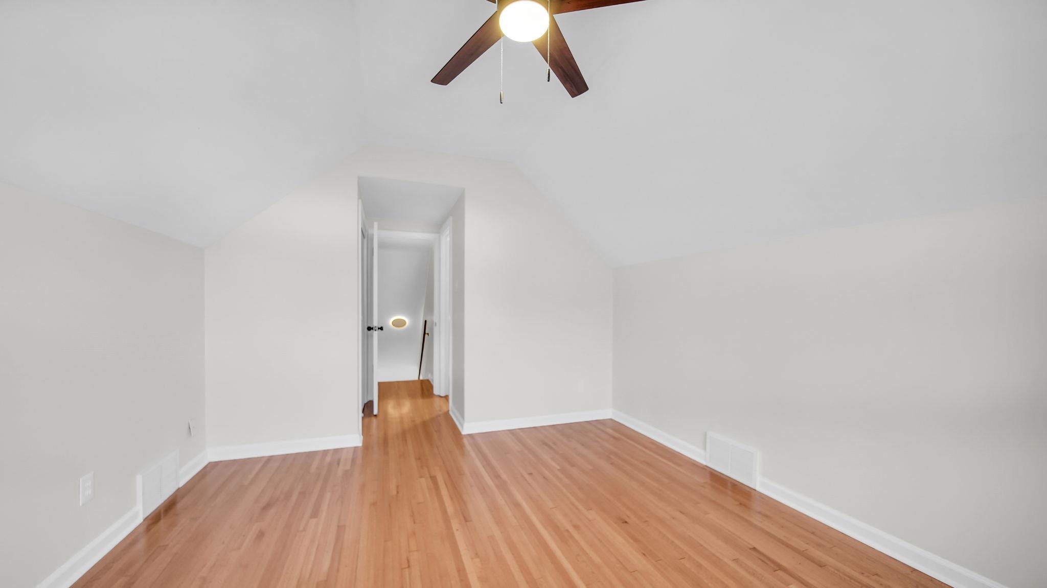 2800 Spring Hill Drive Memphis, TN 38127 - Photo 31 of 31 Additional living space featuring lofted ceiling, light wood-style floors, and a ceiling fan