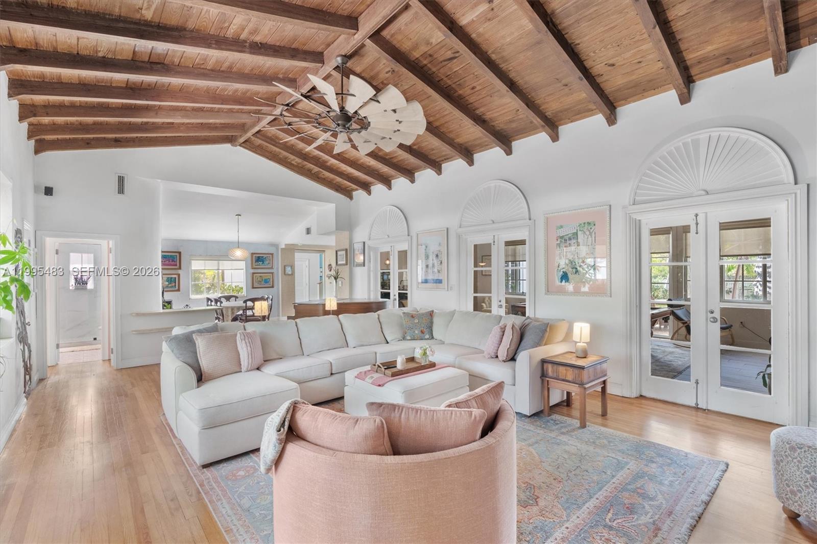 9636 Northeast 5th Avenue Road Miami Shores, FL 33138 - Photo 18 of 86 a living room with furniture and wooden floors