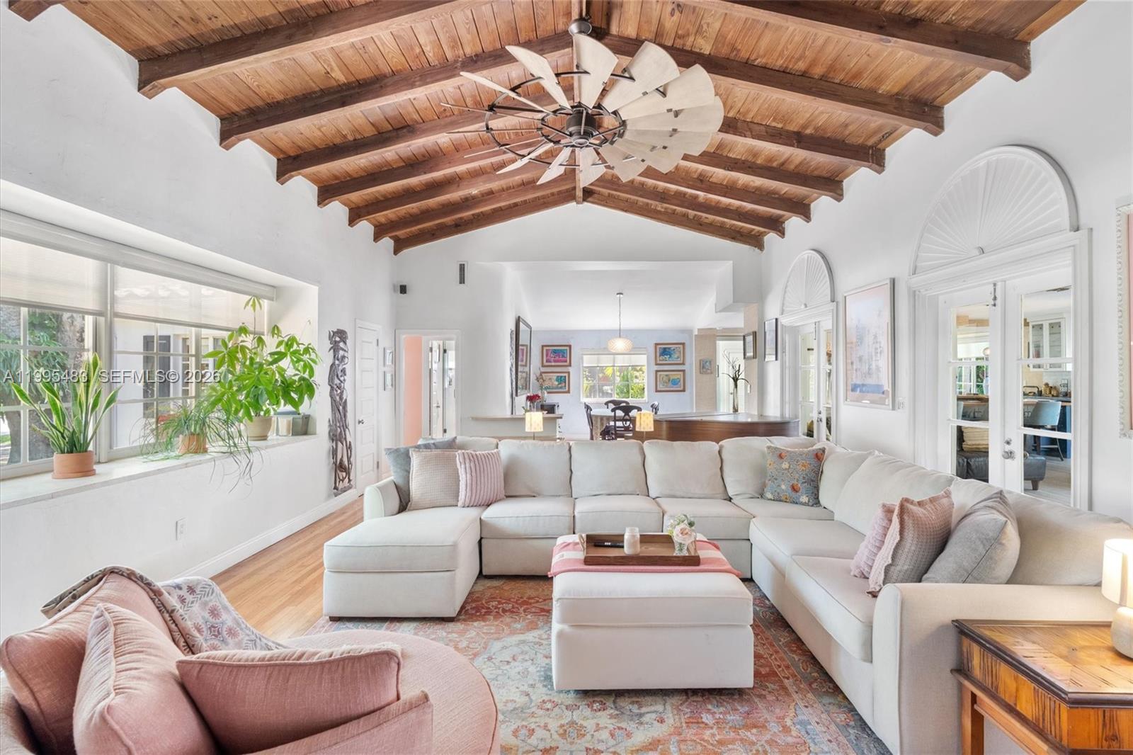 9636 Northeast 5th Avenue Road Miami Shores, FL 33138 - Photo 19 of 86 a living room with furniture and a large window