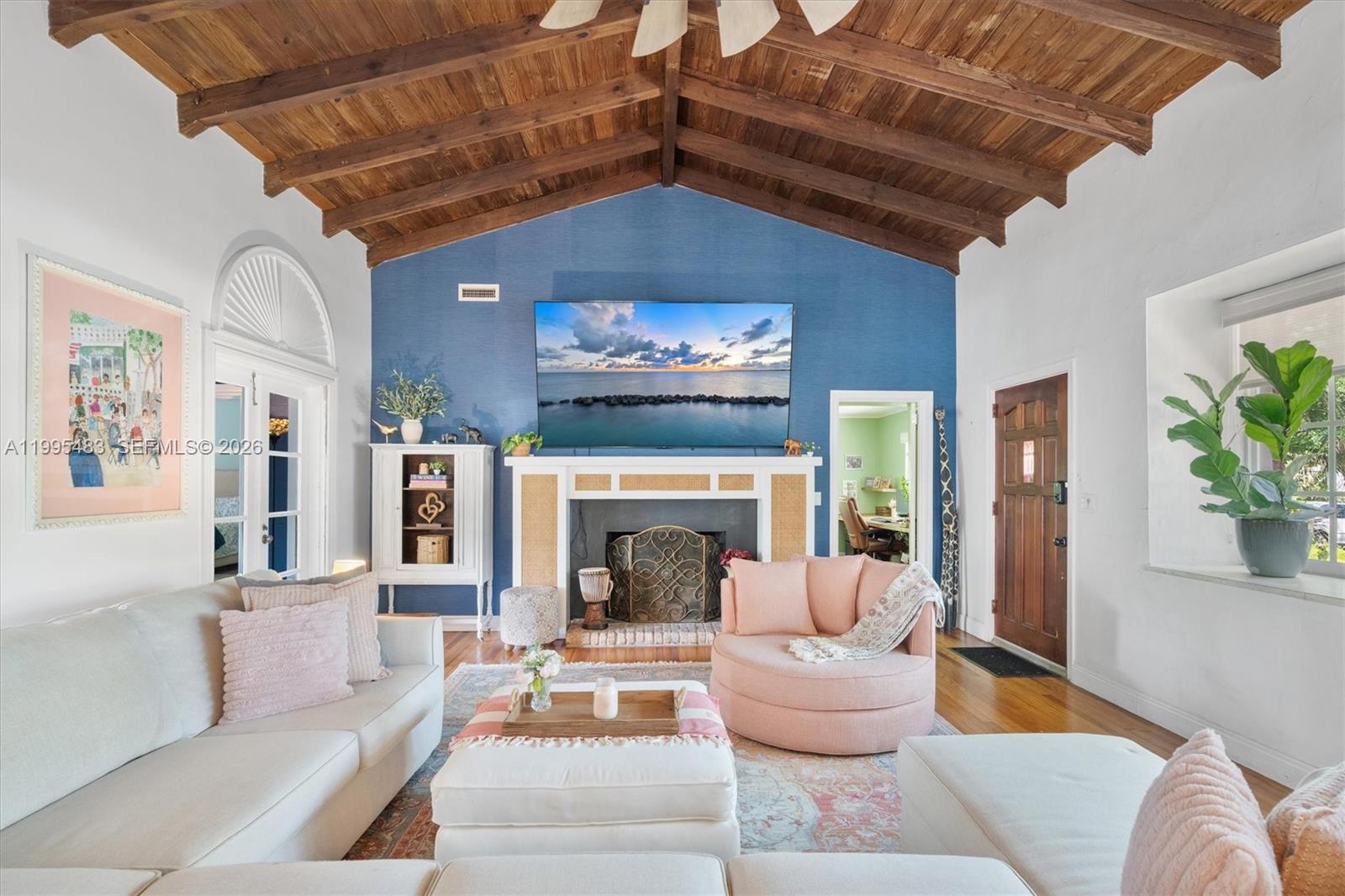 9636 Northeast 5th Avenue Road Miami Shores, FL 33138 - Photo 21 of 86 a living room with furniture and a fireplace
