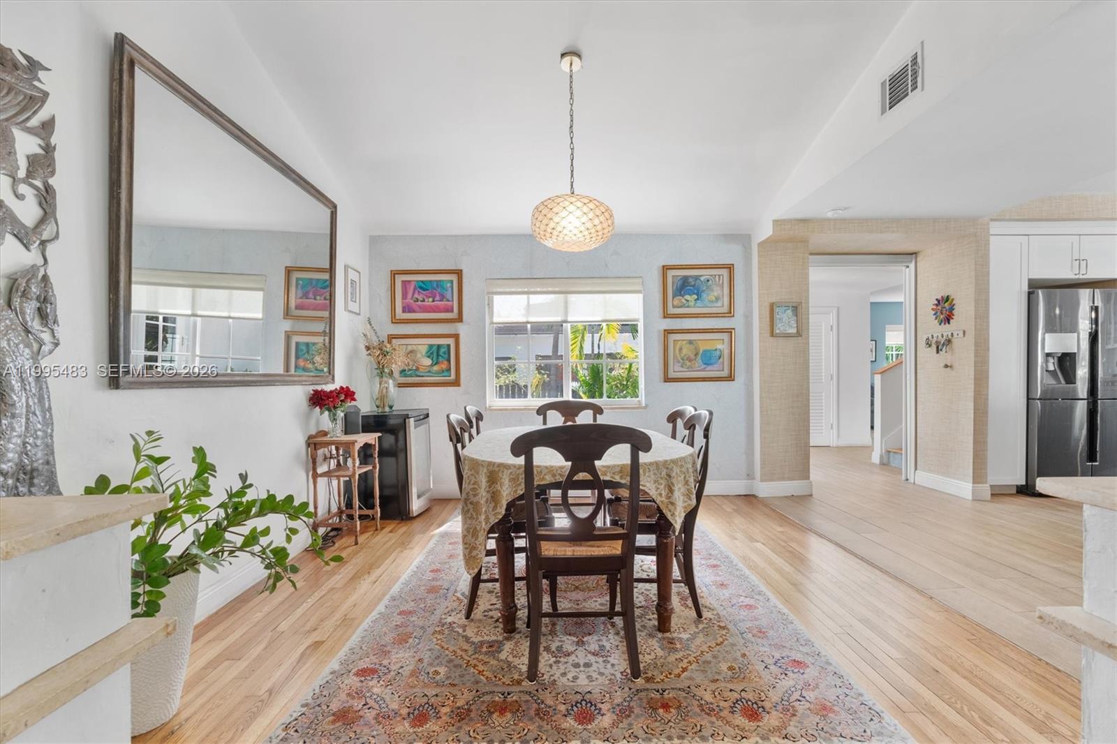 9636 Northeast 5th Avenue Road Miami Shores, FL 33138 - Photo 22 of 86 a view of a dining room with furniture window and wooden floor