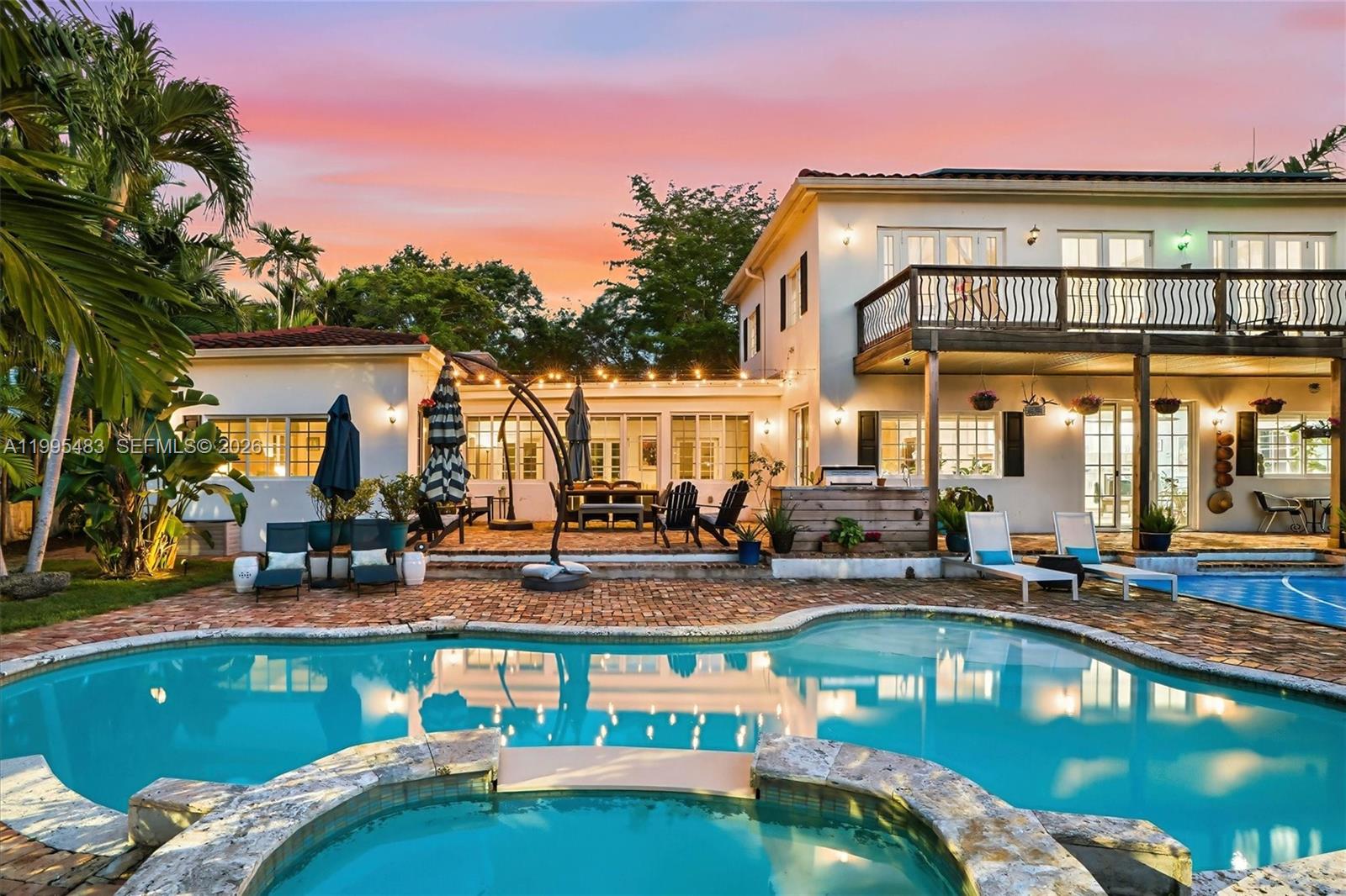 9636 Northeast 5th Avenue Road Miami Shores, FL 33138 - Photo 3 of 86 a view of a swimming pool with outdoor seating