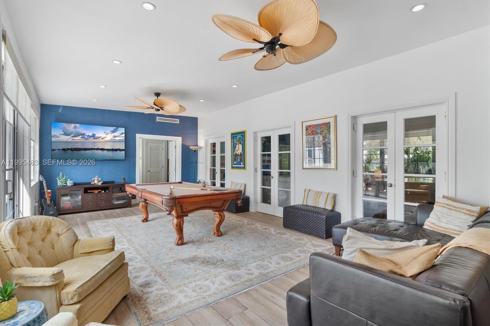 9636 Northeast 5th Avenue Road Miami Shores, FL 33138 - Photo 33 of 86 a living room with furniture and a large window