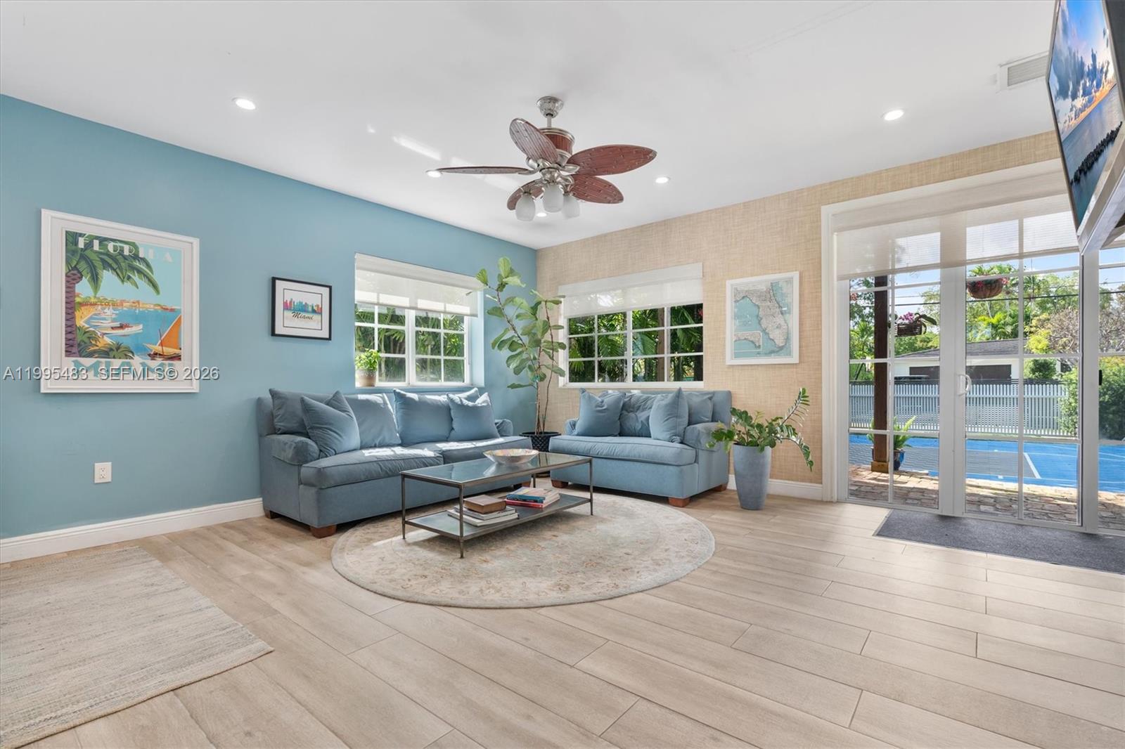 9636 Northeast 5th Avenue Road Miami Shores, FL 33138 - Photo 40 of 86 a living room with furniture and a large window