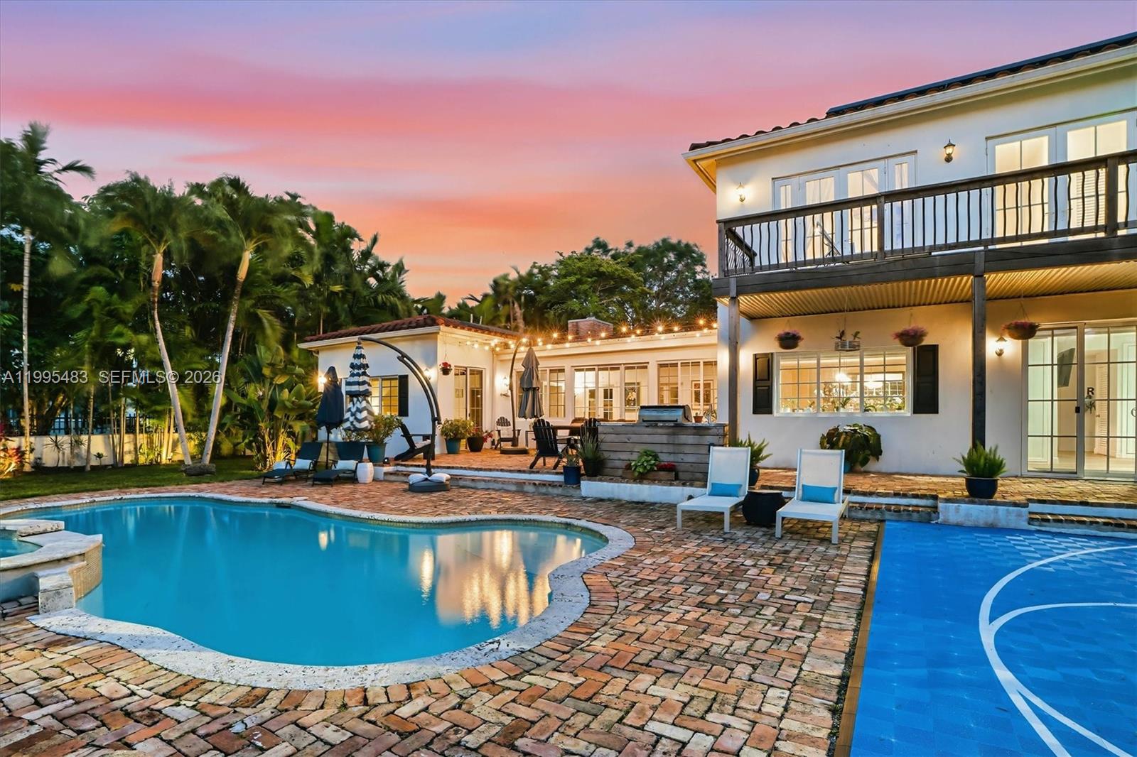 9636 Northeast 5th Avenue Road Miami Shores, FL 33138 - Photo 4 of 86 a view of a house with swimming pool and sitting area