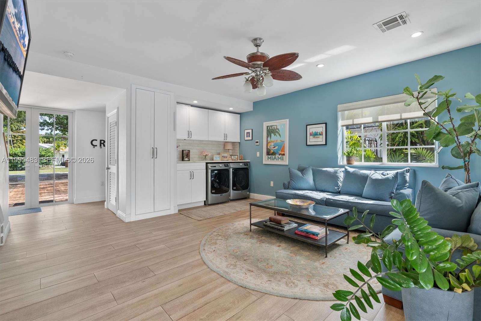 9636 Northeast 5th Avenue Road Miami Shores, FL 33138 - Photo 41 of 86 a living room with furniture and a fireplace