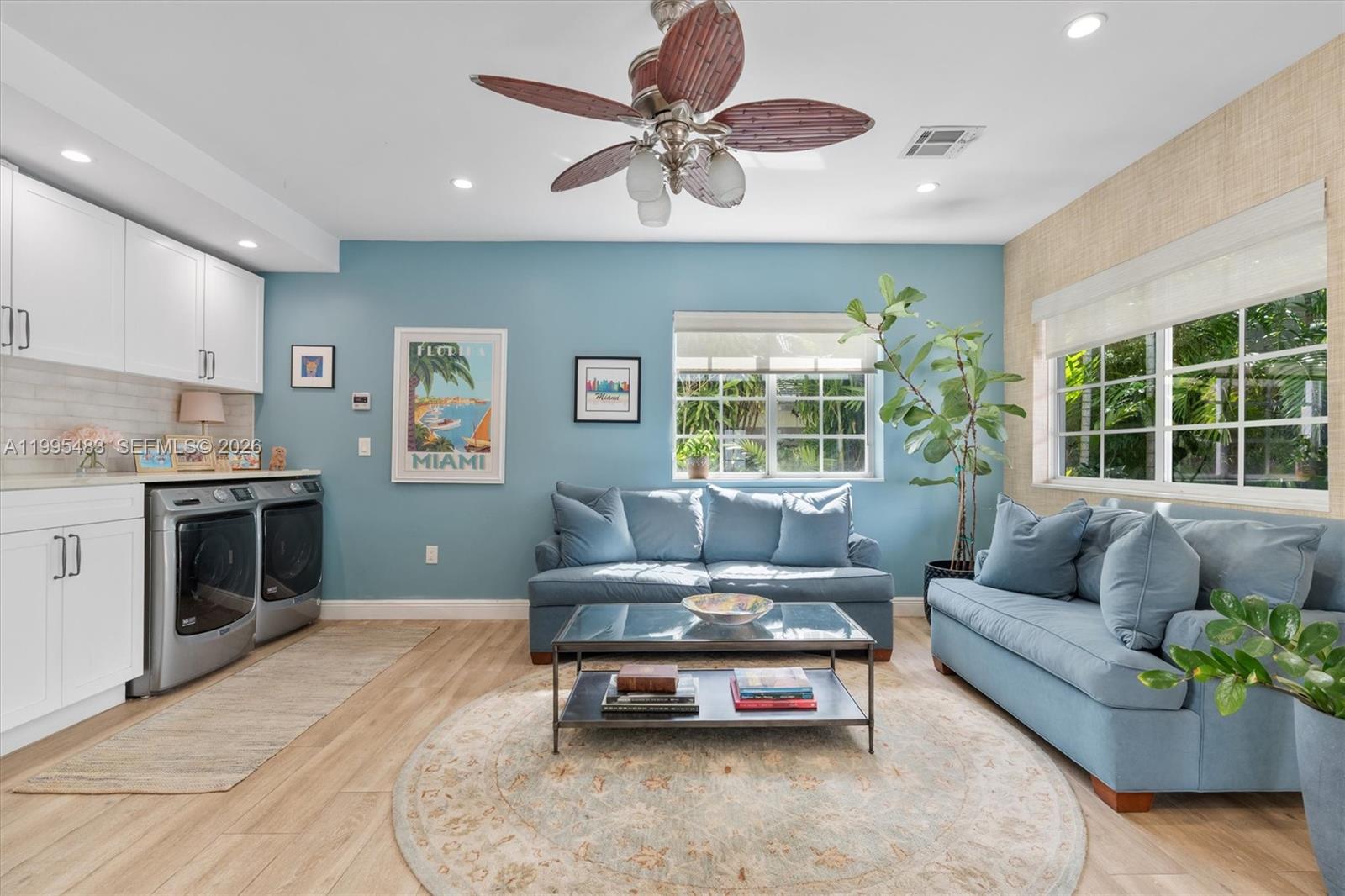 9636 Northeast 5th Avenue Road Miami Shores, FL 33138 - Photo 42 of 86 a living room with furniture and a large window
