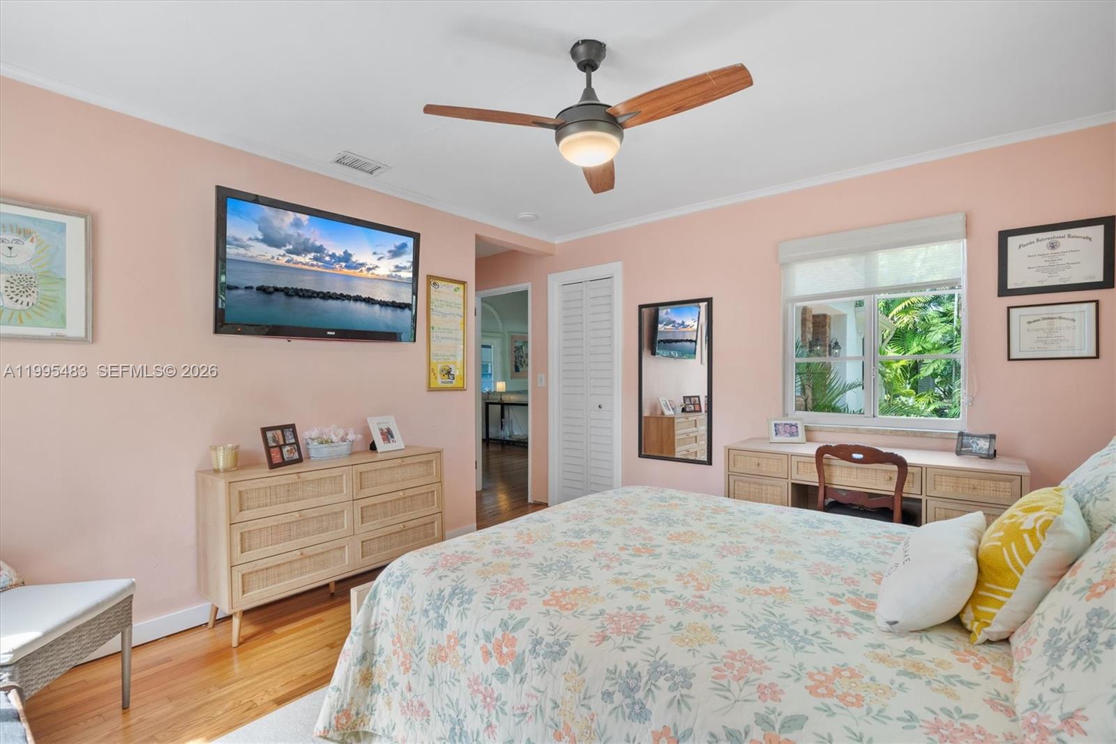 9636 Northeast 5th Avenue Road Miami Shores, FL 33138 - Photo 44 of 86 a bedroom with a bed dresser and a window