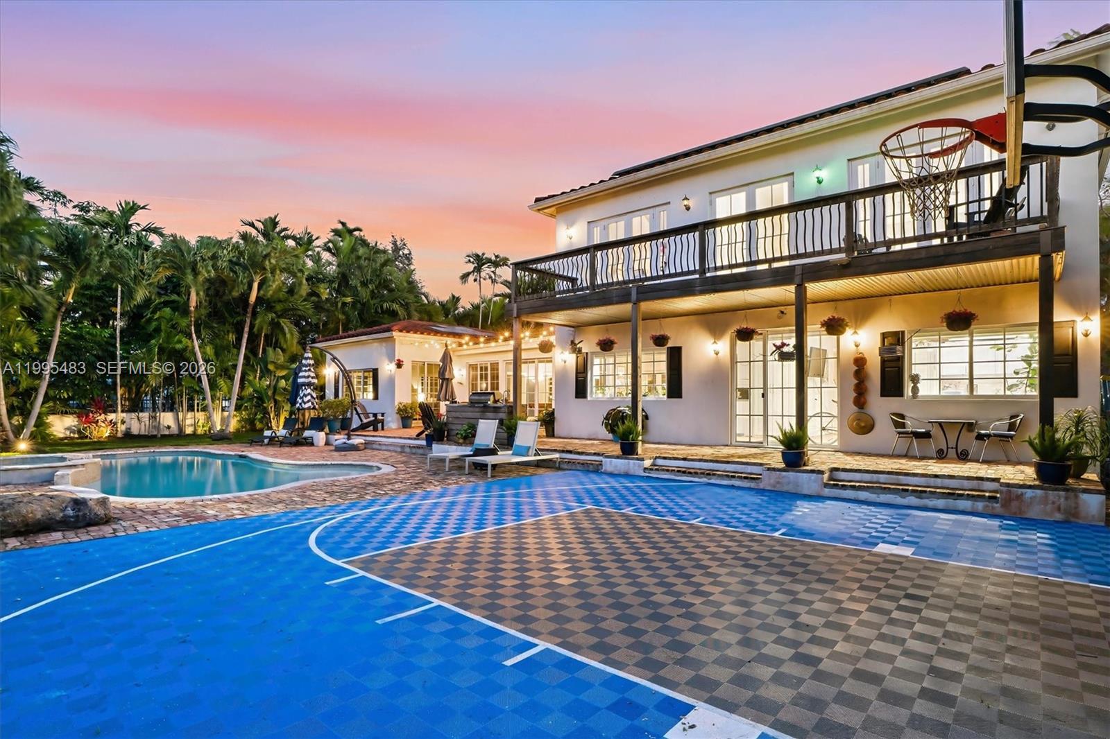 9636 Northeast 5th Avenue Road Miami Shores, FL 33138 - Photo 5 of 86 a view of a building with floor to ceiling windows and pool table