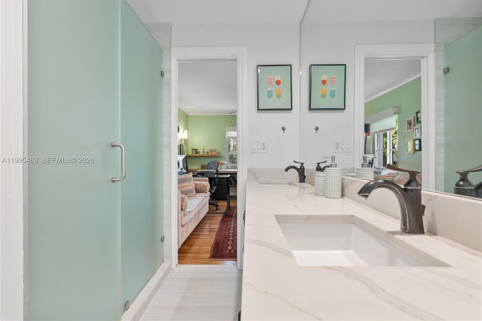 9636 Northeast 5th Avenue Road Miami Shores, FL 33138 - Photo 51 of 86 a en suite spacious bathroom with a tub sink and mirror