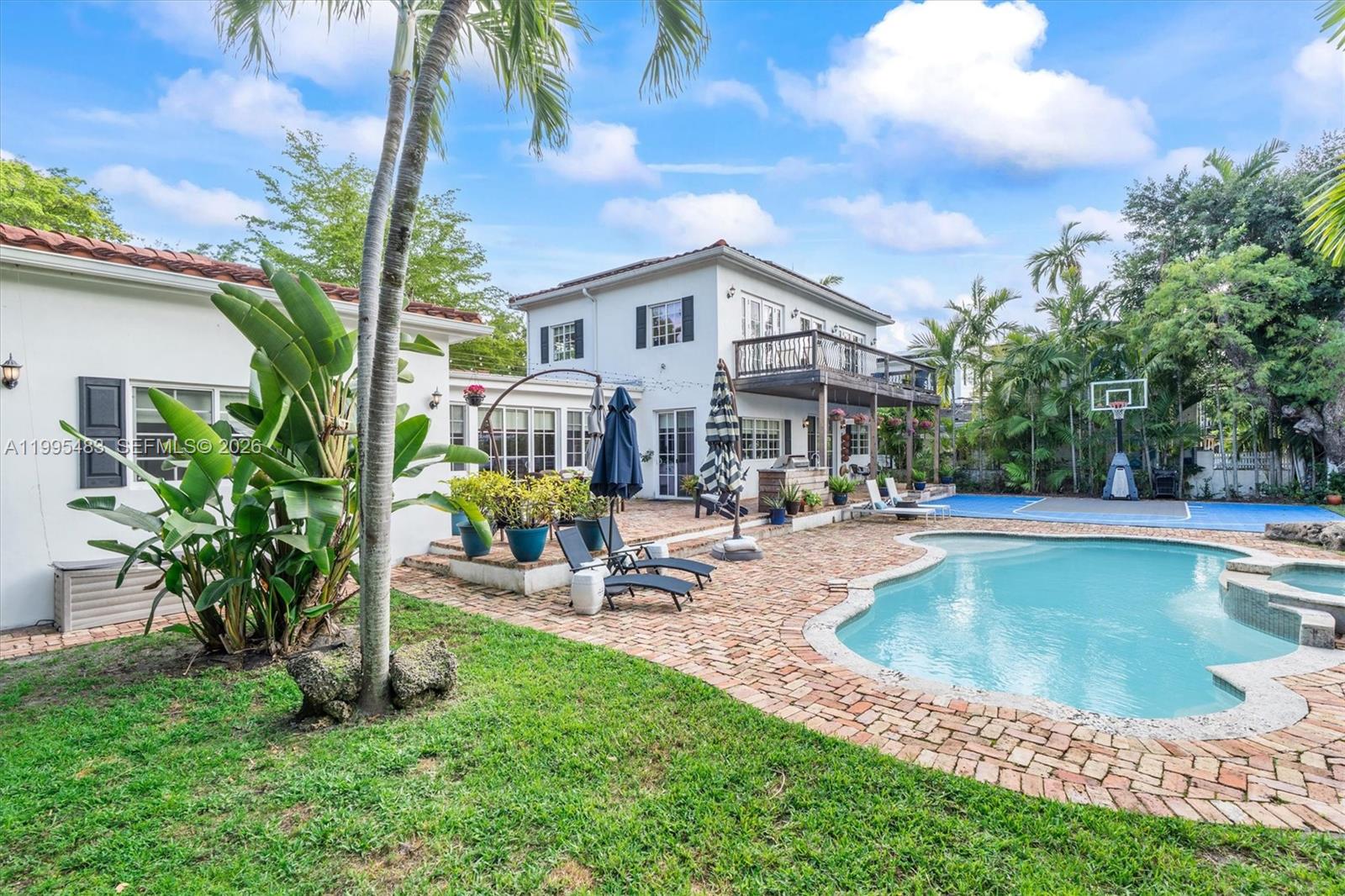 9636 Northeast 5th Avenue Road Miami Shores, FL 33138 - Photo 82 of 86 a view of a house with swimming pool and sitting area