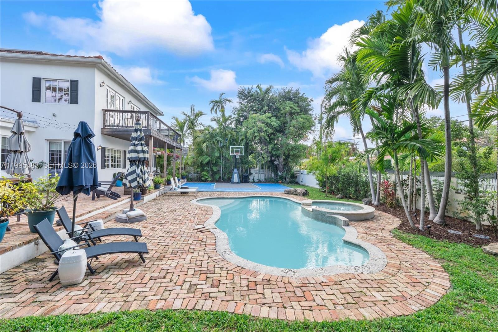 9636 Northeast 5th Avenue Road Miami Shores, FL 33138 - Photo 83 of 86 a view of a house with swimming pool and sitting area