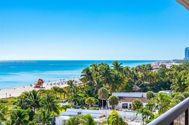 a view of a yard with an ocean view