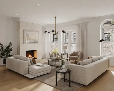 a living room with furniture a fireplace and a chandelier