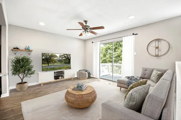a living room with furniture and a large window