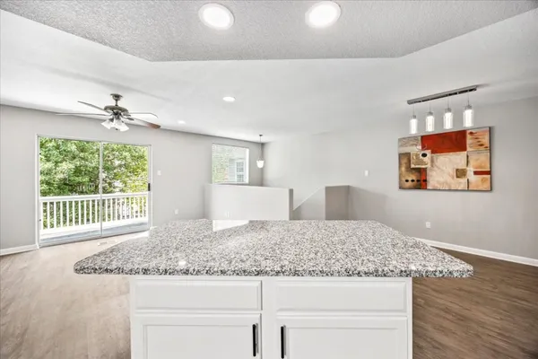 a view of house with garage and yard