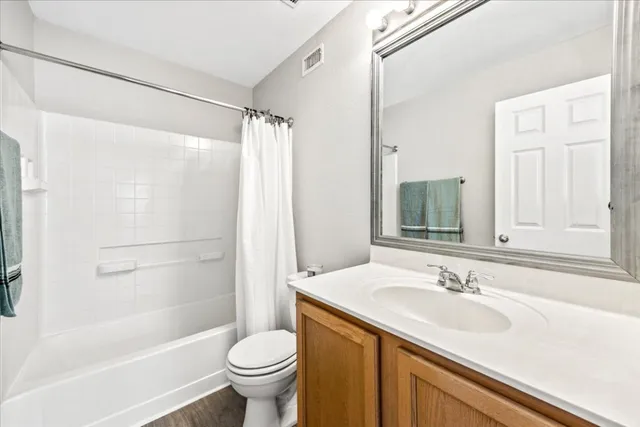 an aerial view of a house with a yard and garden