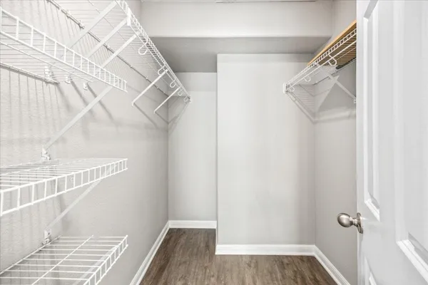 an aerial view of a house with a yard and lake view