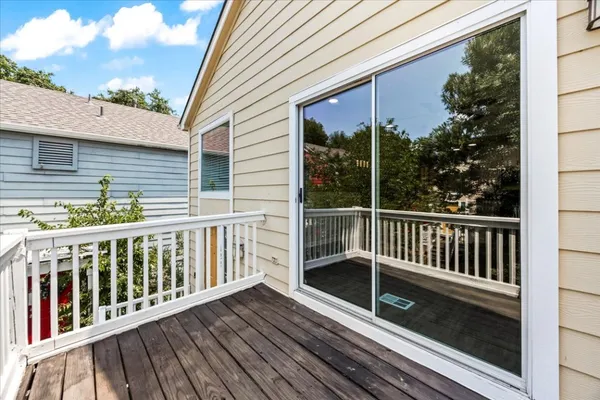 a view of a kitchen with a sink cabinets and wooden floor