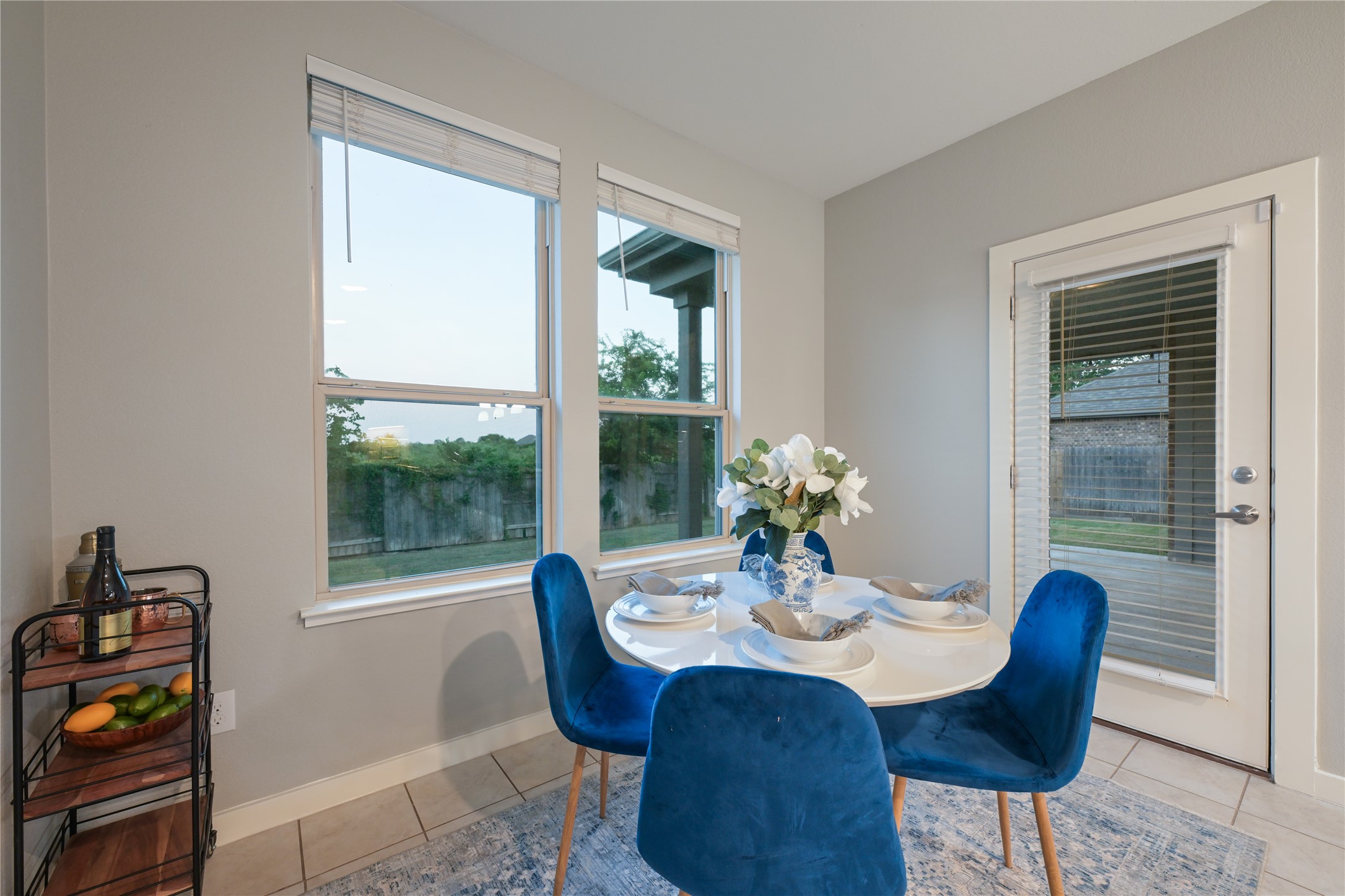 188 Nautical Loop Kyle, TX 78640 - Photo 18 of 38 A well-lit dining area offers direct access to the outdoors, perfect for casual meals.