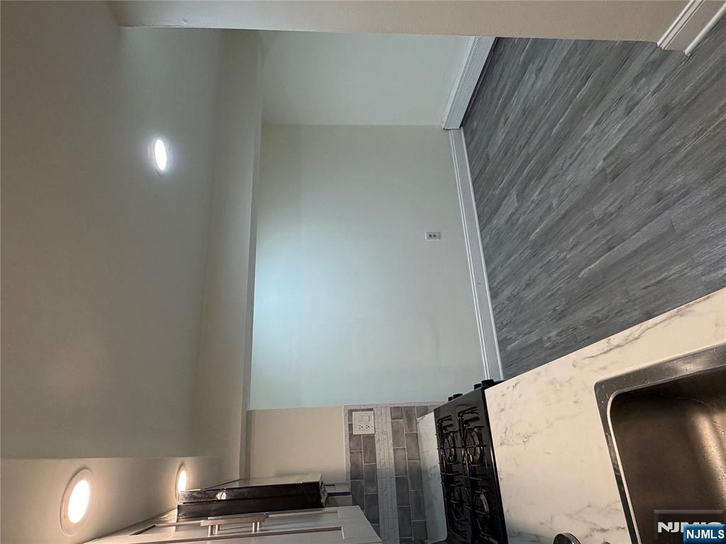 7810 3rd Avenue North Bergen, NJ 07047 - Photo 3 of 13 a kitchen with a sink and cabinets