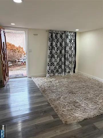 a view of a floor to ceiling window and wooden floor