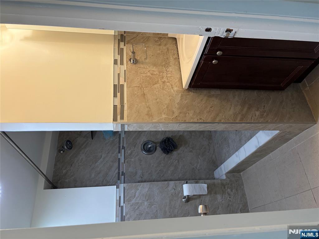 7810 3rd Avenue North Bergen, NJ 07047 - Photo 10 of 13 a bathroom with a shower