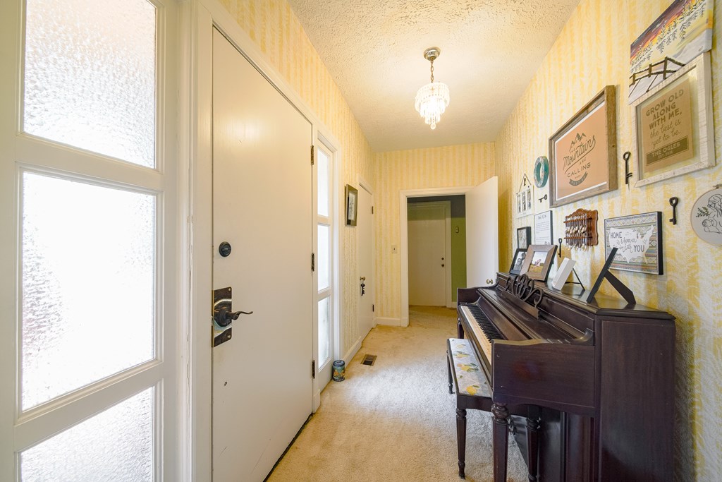410 3rd Street Manchester, GA 31816 - Photo 14 of 45 a view of a hallway with furniture and a window