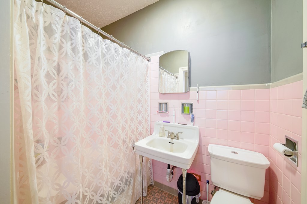 410 3rd Street Manchester, GA 31816 - Photo 19 of 45 a bathroom with a sink a toilet and a mirror