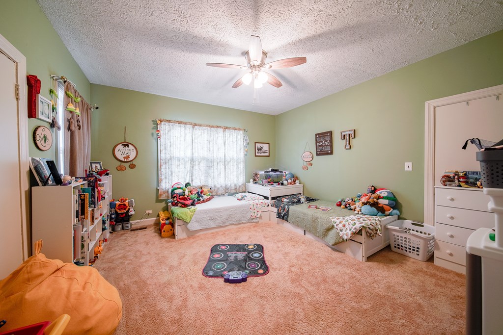410 3rd Street Manchester, GA 31816 - Photo 20 of 45 a living room with furniture and a window
