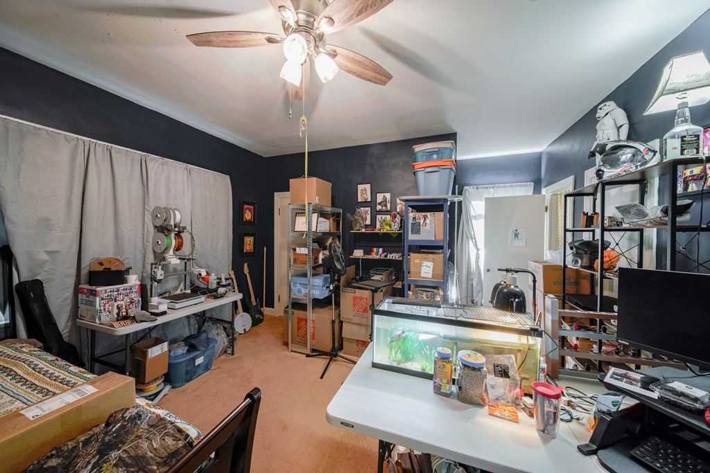 410 3rd Street Manchester, GA 31816 - Photo 27 of 45 a workspace with furniture and a flat screen tv