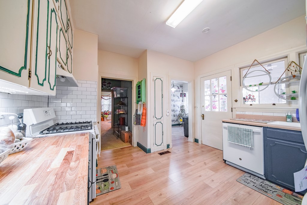 410 3rd Street Manchester, GA 31816 - Photo 33 of 45 a kitchen with stainless steel appliances granite countertop a stove and a sink