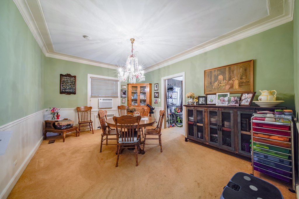 410 3rd Street Manchester, GA 31816 - Photo 39 of 45 a view of a dining room with furniture and chandelier