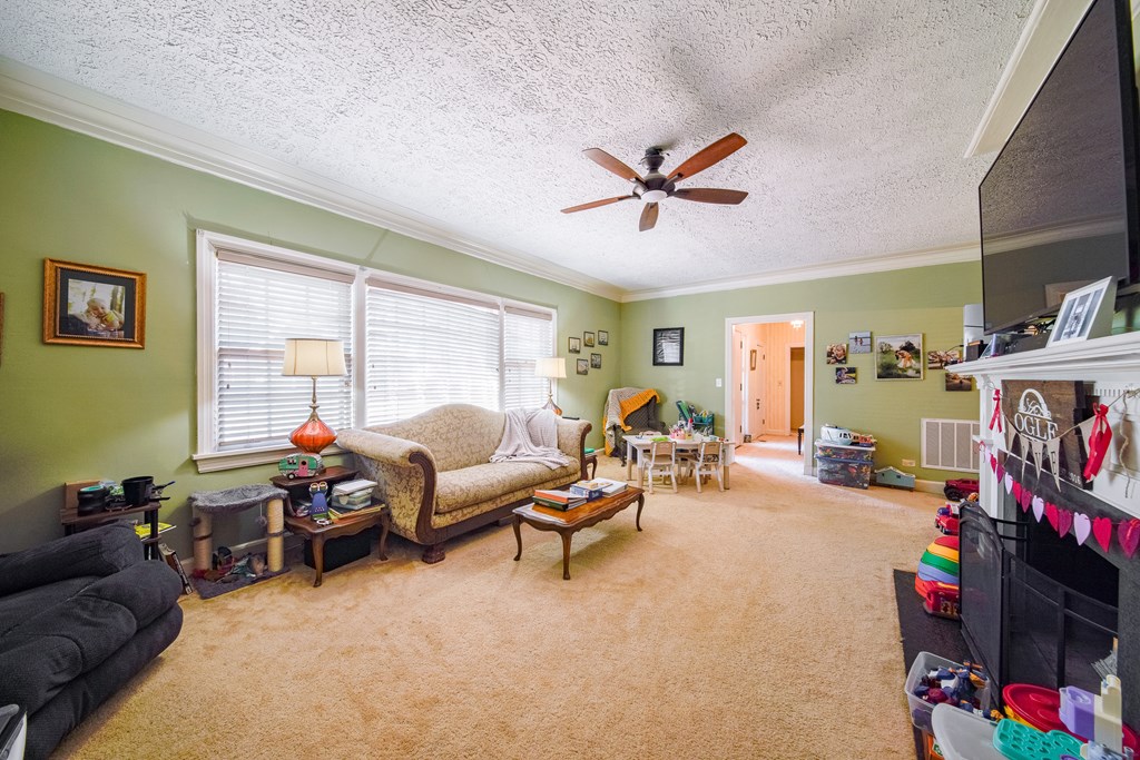 410 3rd Street Manchester, GA 31816 - Photo 42 of 45 a living room with furniture and a flat screen tv