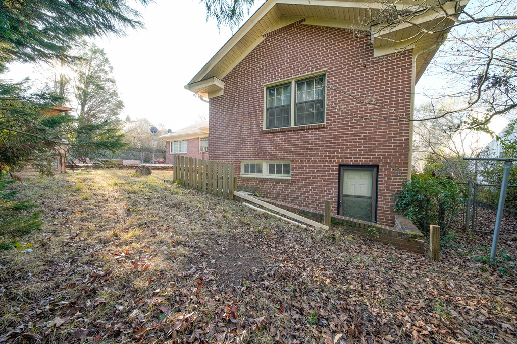 410 3rd Street Manchester, GA 31816 - Photo 6 of 45 a backyard of a house with lots of green space